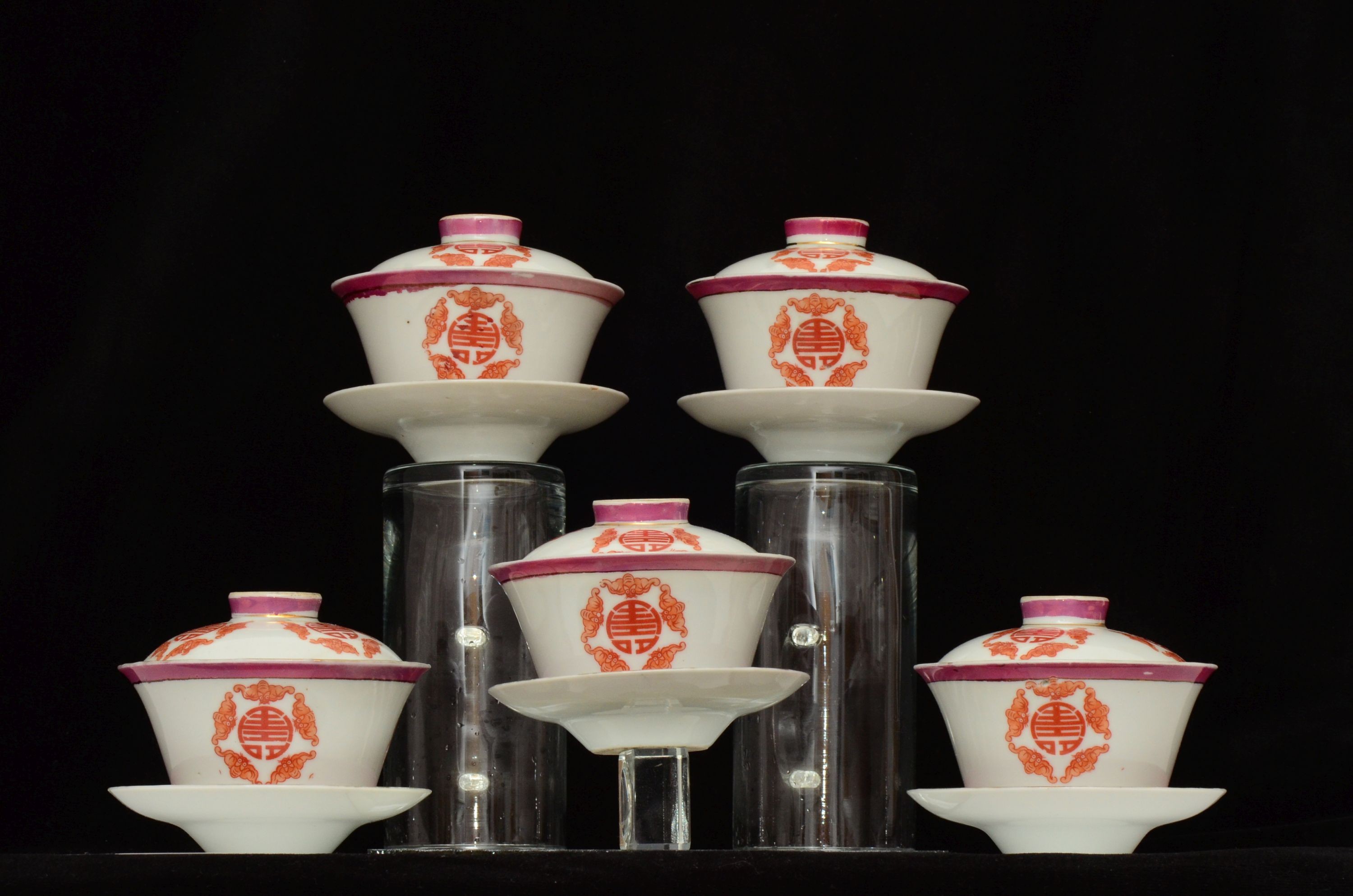 A set of five Chinese teabowls, covers and stands and a similar 'dragon' vase, 23cm